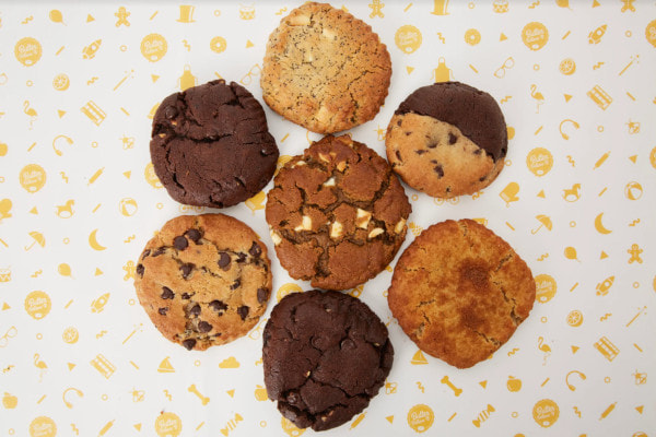 seven cookies on sheet of paper
