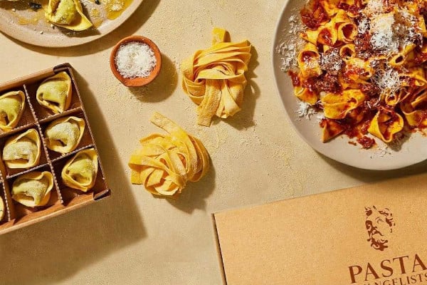 fresh pasta in boxes and on a plate